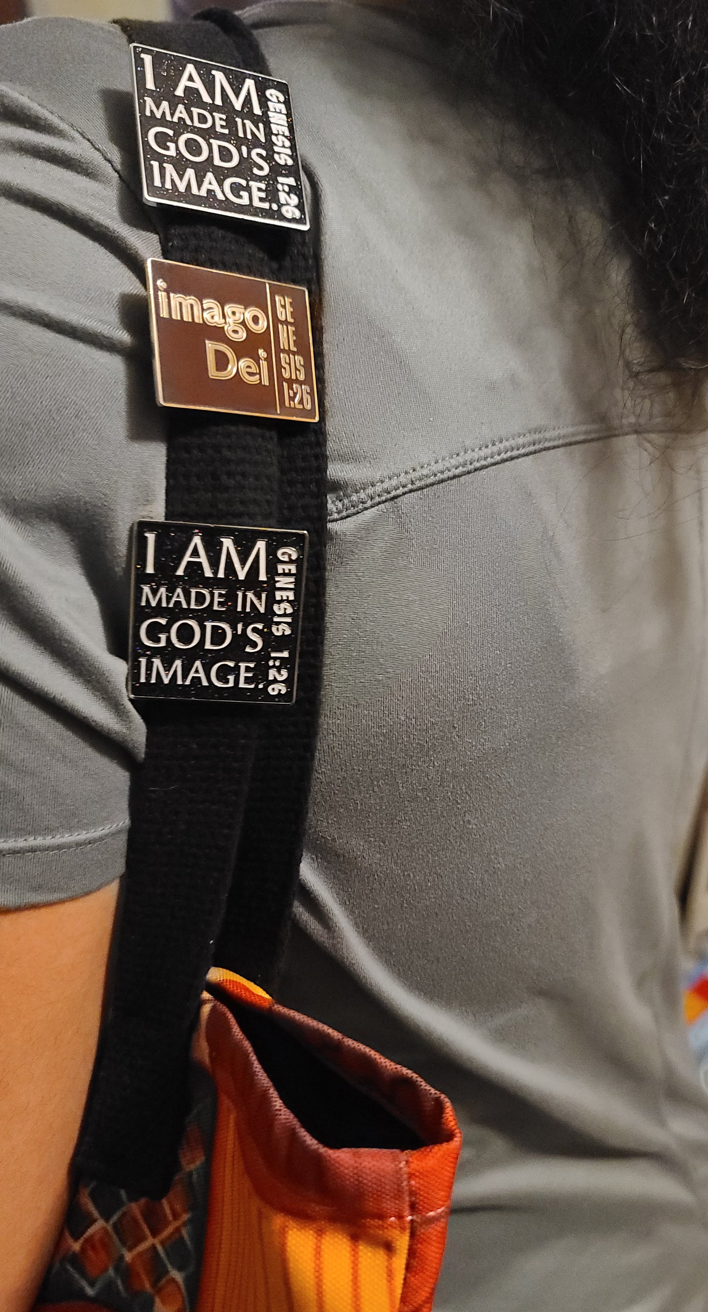 03-imago Dei. Exclusive Enamel Pin. Shiny Gold Metal – Raised Lettering.