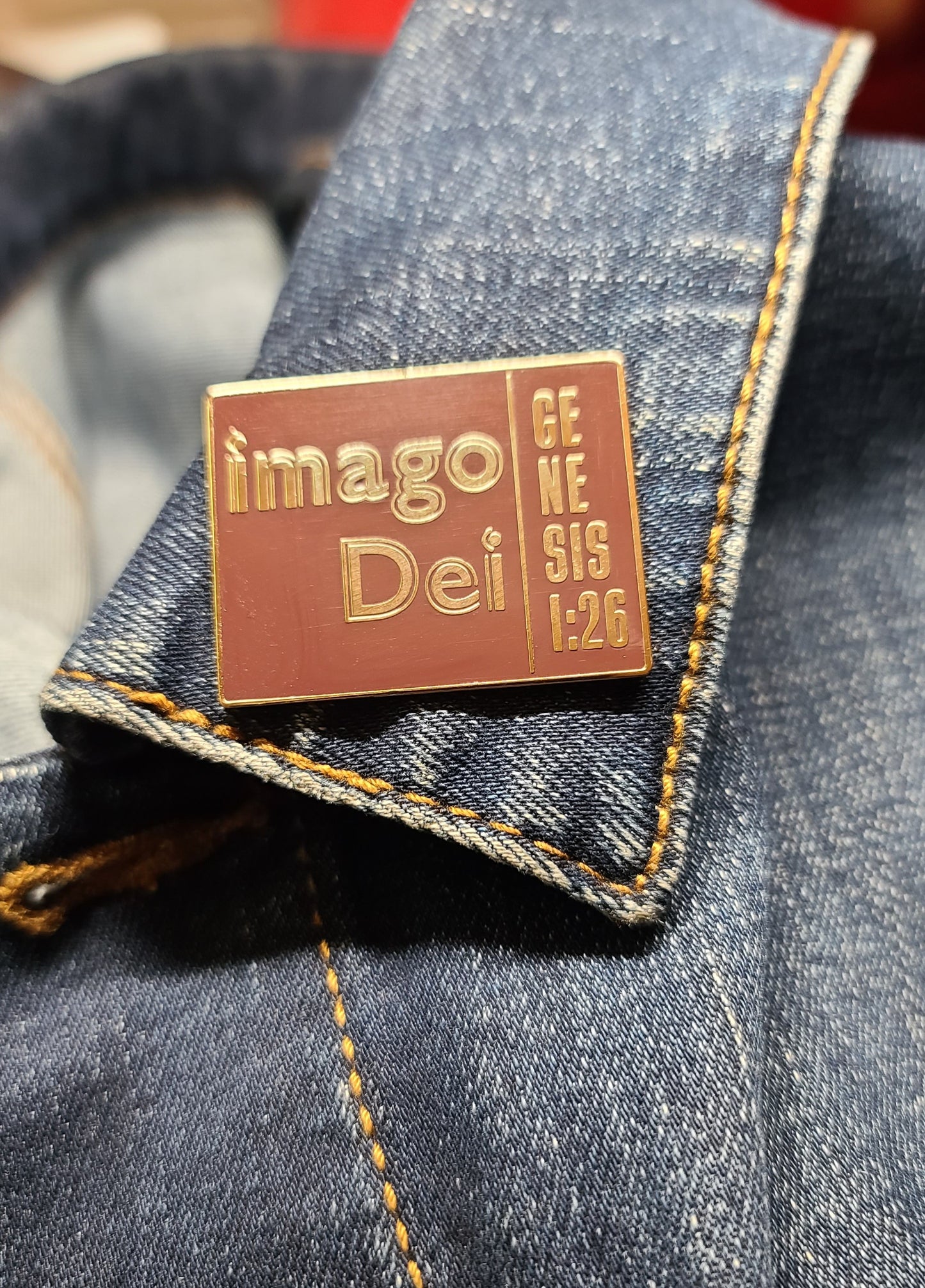 03-imago Dei. Exclusive Enamel Pin. Shiny Gold Metal – Raised Lettering.